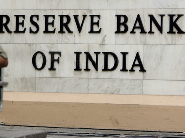 A security officer prepares to sit outside the head office of Reserve Bank of India in Mumbai